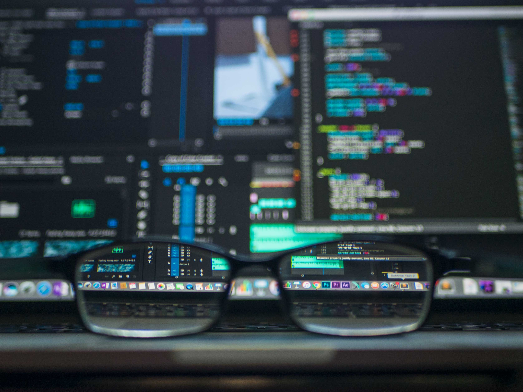 Code reflected in a pair of glasses